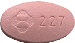227と書かれたピンク色の錠剤